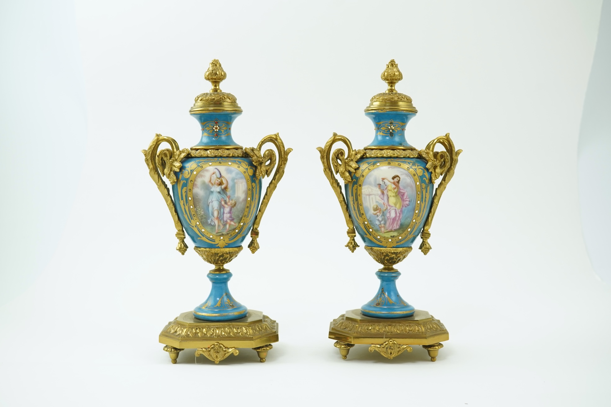 A pair of late 19th century ormolu mounted Sevres style porcelain cassolettes